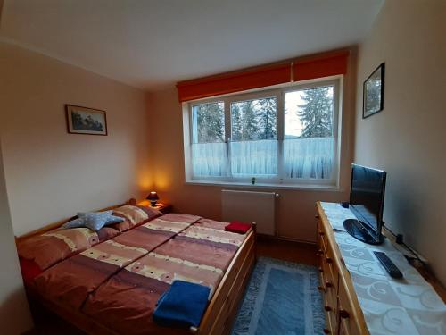 מיטה או מיטות בחדר ב-ZŁOTY BUK