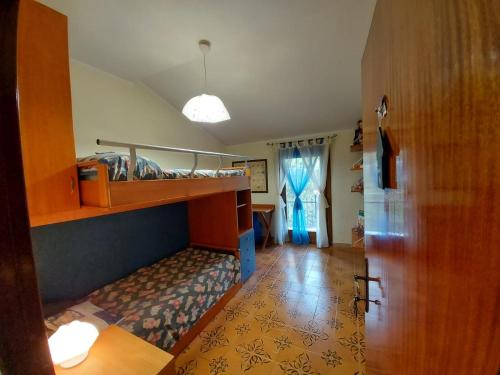 a room with a bunk bed and a hallway at B&B Nonna Assunta in Collegiove