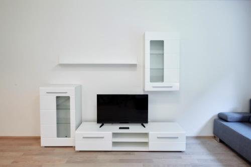 Телевизор и/или развлекательный центр в Residence Port Karolina