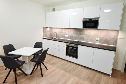 Кухня или мини-кухня в Residence Port Karolina
