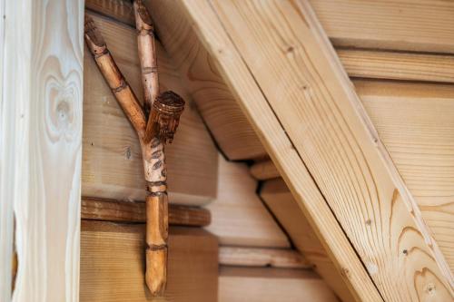 a group of bamboo poles on the side of a building at Willa w Ubocy - "Jacuzzi i Sauna w ofercie dodatkowo płatnej" in Murzasichle