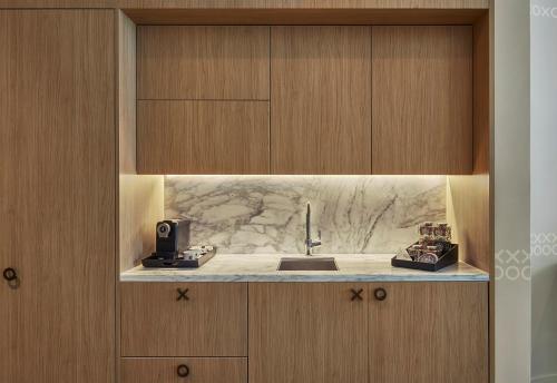 a kitchen with a sink and a counter at SLS LUX Brickell in Miami