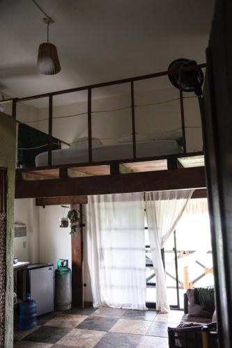 a bedroom with two bunk beds in a room at Beach Front Guesthouse in Puerto Escondido