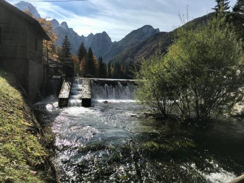 a waterfall in the middle of a river at Haus Tilia Karinthië Appartementen in Nötsch