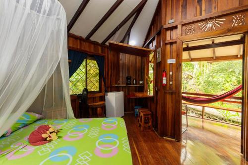 Postel nebo postele na pokoji v ubytování Bungalows Aché Cahuita