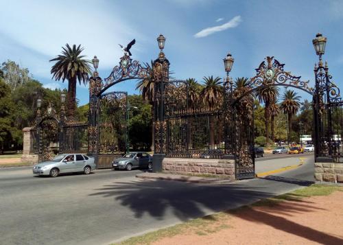 a gate with a bird on top of it on a street at Amplio y cómodo - Excelente ubicación in Mendoza