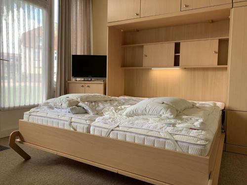 Postel nebo postele na pokoji v ubytování Haus-Sonnenwinkel-Bungalow-12