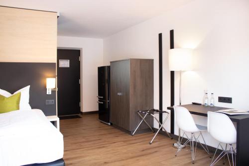 Postel nebo postele na pokoji v ubytování KF Hotel by WMM Hotels