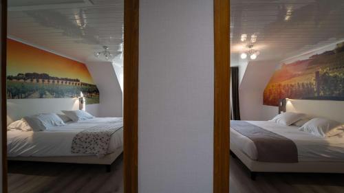 Un pat sau paturi într-o cameră la Best Western Hotel Ile de France