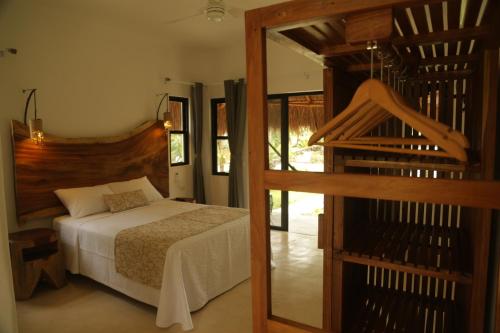 Postel nebo postele na pokoji v ubytování Mi Kasa Tu Kasa Bacalar by Nah Hotels