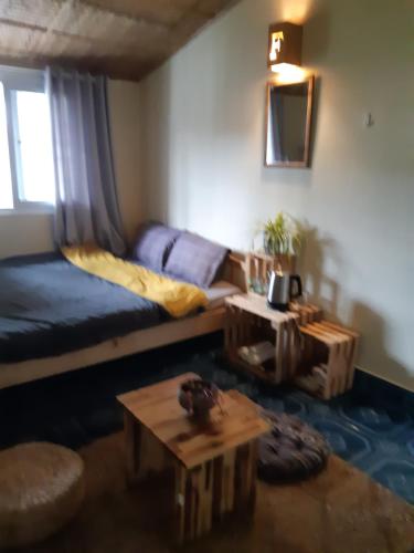 a living room with a couch and a table at Forelsket 2 in Da Lat