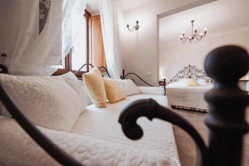 Posteľ alebo postele v izbe v ubytovaní Antica Torre del Borgo