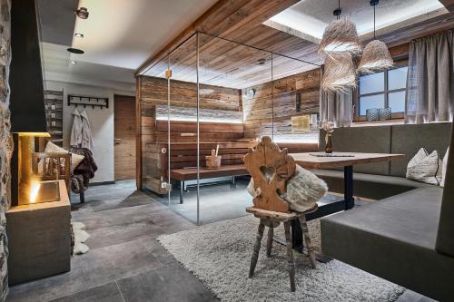 a room with a table and a chair in it at Rainerhof in Flachau