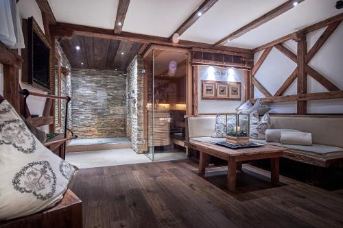 a living room with a couch and a table at Rainerhof in Flachau