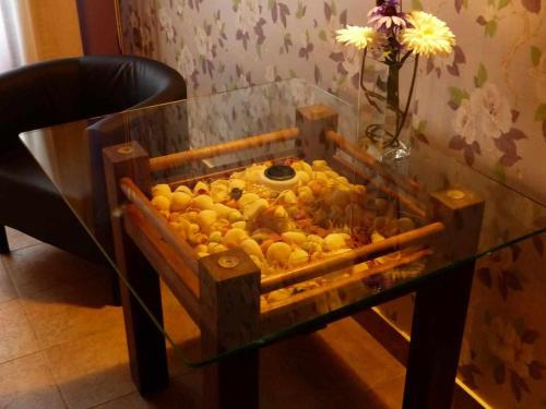 a box of lemons sitting on a glass table at La casa de Don in Pedraza-Segovia