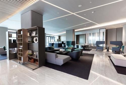 a living room with a couch and a table at Crowne Plaza Shenzhen World Exhibition and Convention Center by IHG in Shenzhen
