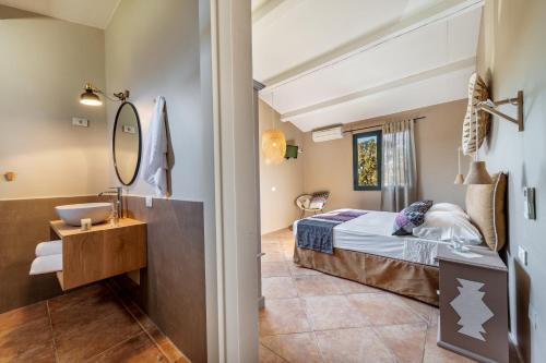 a hotel room with a bed and a mirror at Borgo di Campagna in Porto San Paolo