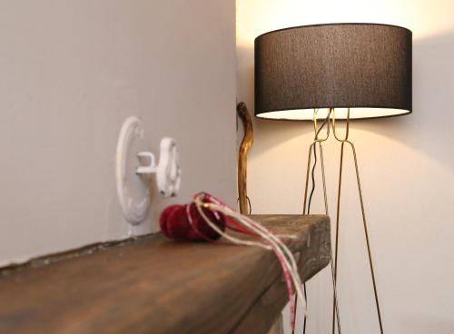 a lamp sitting on top of a table at Petrines Villes Avramilias in Avramiliá