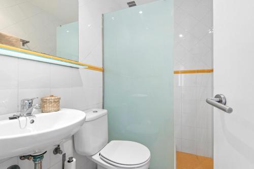 a bathroom with a toilet and a sink and a shower at Arenal Jardín 56-2 - Arenal den Castell in Arenal d'en Castell
