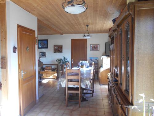 a kitchen and dining room with a table and chairs at Greselin in Chorges