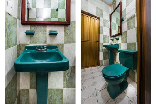 a bathroom with a green sink and a toilet at Hotel San Marcos in Los Mochis
