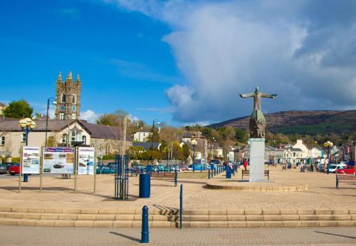 a statue of a christ the redeemer in a city at Island View Cottage Bantry by Trident Holiday Homes in Bantry