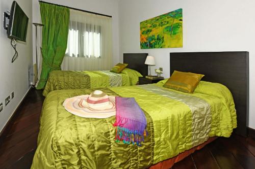 A bed or beds in a room at Salobre Imperial La Canela