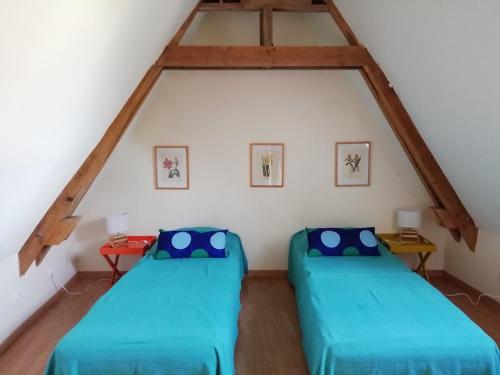 En eller flere senge i et værelse på Le Petit Villandry