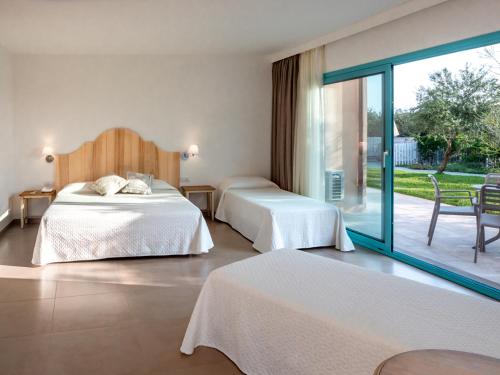 Postel nebo postele na pokoji v ubytování Park Hotel Asinara