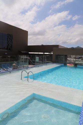 a large swimming pool on top of a building at Hotel Catedral Plaza in Santa Marta