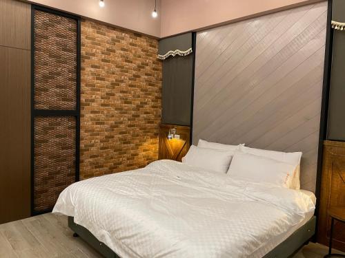 Cama o camas de una habitación en 山川匯行館民宿