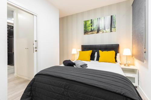 Madrid Rio Apartment tesisinde bir odada yatak veya yataklar
