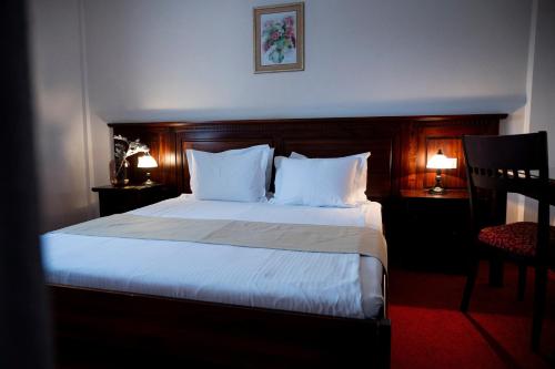 Postel nebo postele na pokoji v ubytování Hotel Bohemia