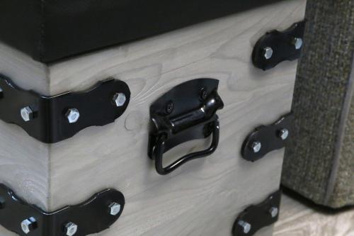 a set of four black door handles on a wooden floor at Petrines Villes Avramilias in Avramiliá