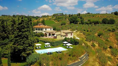 an aerial view of a house on a hill at Podere Vigliano in Tavarnelle in Val di Pesa