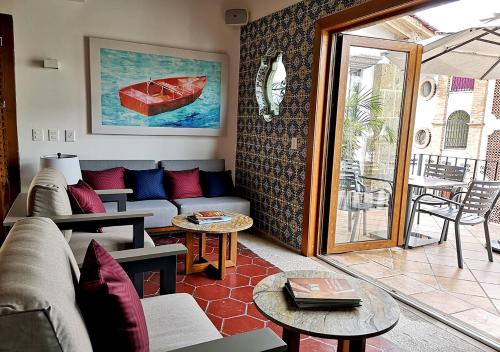 a living room with a couch and a table at Casa Carmen in Puerto Vallarta