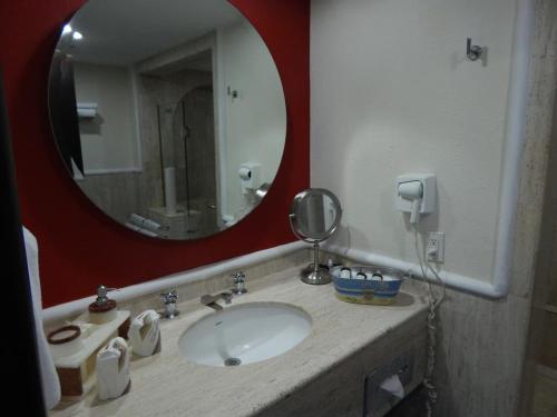 a bathroom with a sink and a mirror at Studio At Marina Los Cabos in Cabo San Lucas
