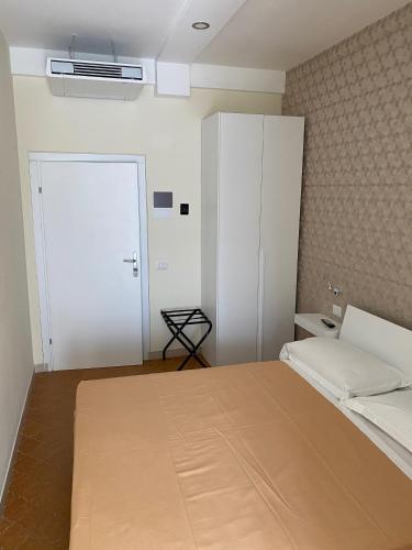 Postel nebo postele na pokoji v ubytování Acquaviva Experience B&B