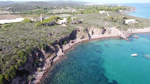 an aerial view of an island with a boat in the water at Dimora Ferralasco in Carloforte