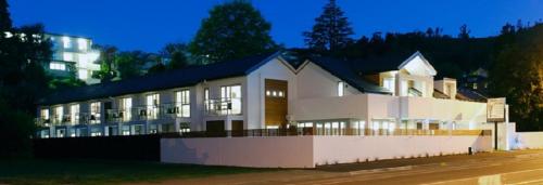 a large white building with a lot of windows at Century Park in Nelson