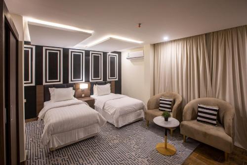 Tempat tidur dalam kamar di فندق شجرة الزيتون Olive Tree Hotel