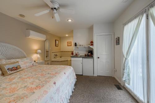 a bedroom with a bed and a kitchen and a window at 2310 Central Avenue in North Wildwood