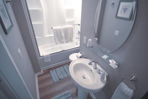 a small bathroom with a sink and a mirror at Tucker Peak Lodge in Julian