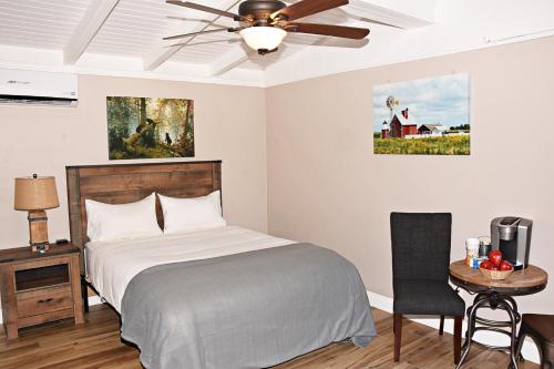 a bedroom with a bed and a ceiling fan at Apple Tree Inn in Julian