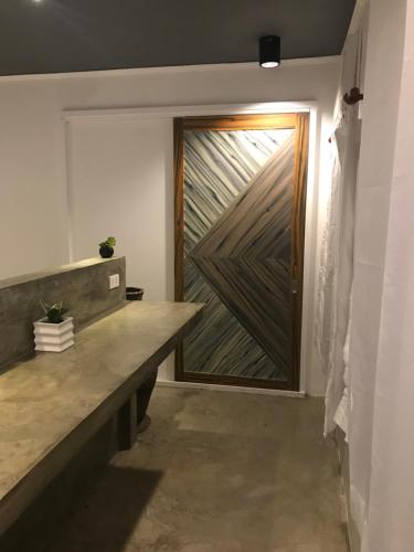 a door in a room with a counter and a door at PAYAG SUITES in General Luna