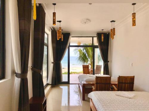 Ένα ή περισσότερα κρεβάτια σε δωμάτιο στο Timothe Beach Apartments