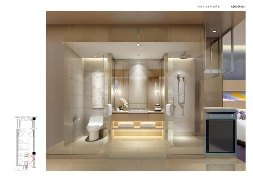a bathroom with a toilet and a sink at Novotel Changsha International Exhibition Center in Changsha