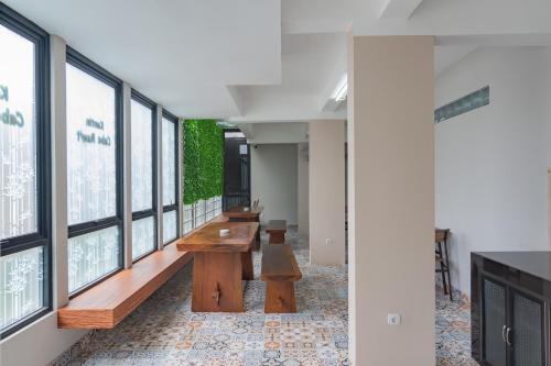 a row of benches in a room with windows at RedDoorz Plus @ Cirebon City Center in Cirebon