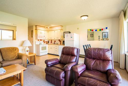 a living room with a couch and a chair at Hi-Tide Resort in Moclips