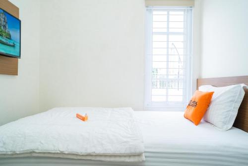 Postel nebo postele na pokoji v ubytování KoolKost Syariah near Jl Pajajaran Bogor